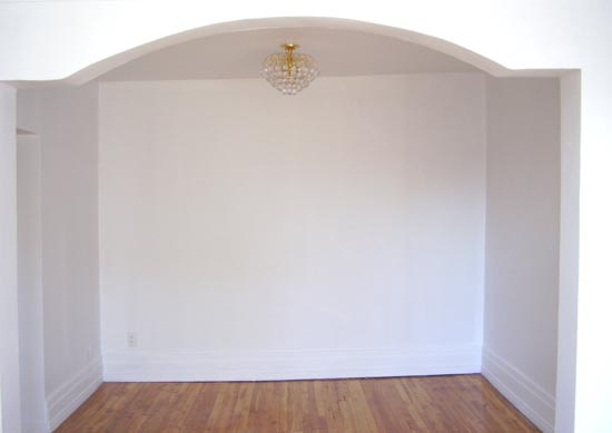 Room of simple whites finished painted walls, mural and ceiling.
